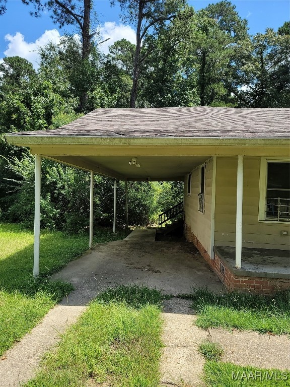 view of parking / parking lot with a carport