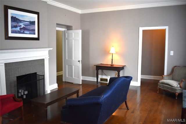 living room with a fireplace, crown molding, and dark hardwood / wood-style floors