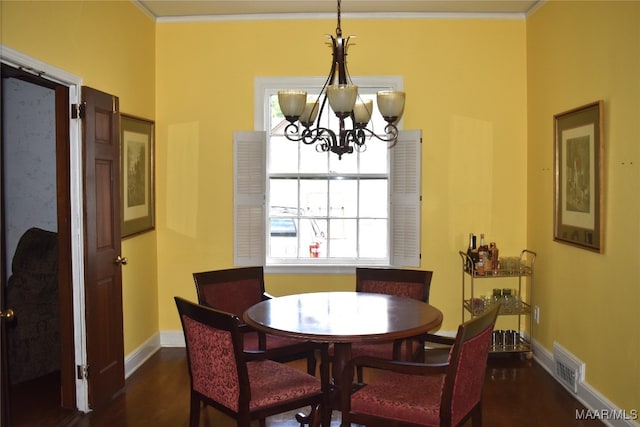 dining area featuring a wealth of natural light, dark hardwood / wood-style floors, and a notable chandelier