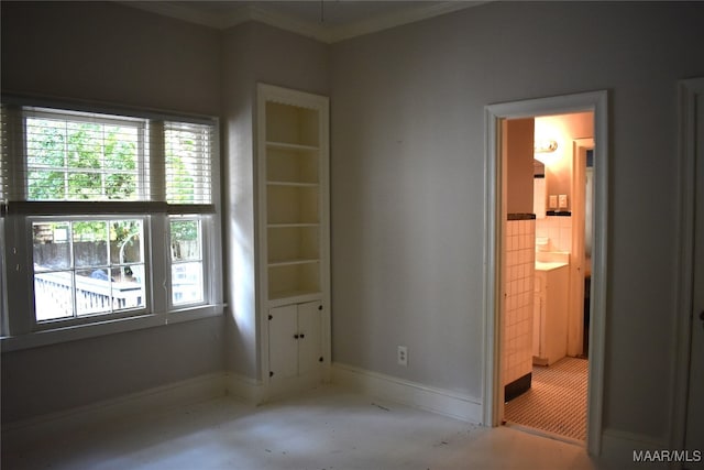 spare room with a wealth of natural light and ornamental molding