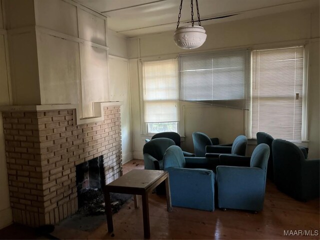 living room featuring a fireplace and hardwood / wood-style flooring