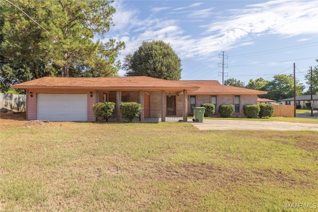 single story home with a garage and a front yard