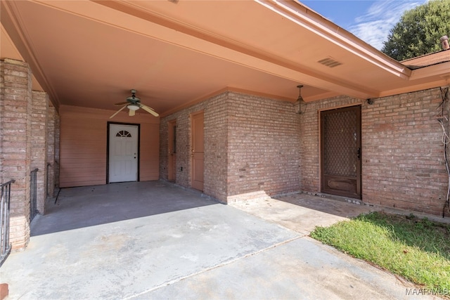 view of exterior entry featuring ceiling fan