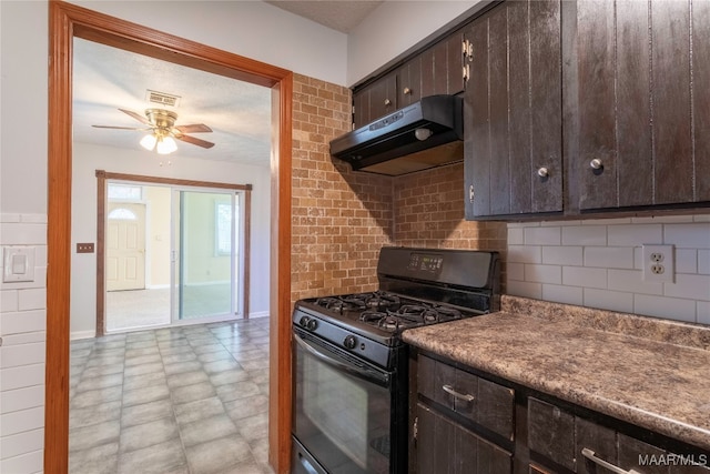 kitchen featuring black gas range oven, ceiling fan, a textured ceiling, and extractor fan