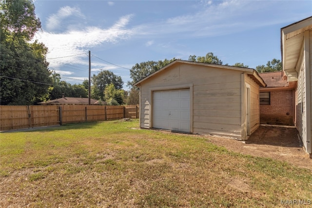 garage with a lawn