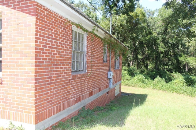 view of home's exterior featuring a yard