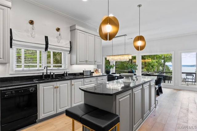 kitchen featuring gray cabinets, black dishwasher, crown molding, and a sink