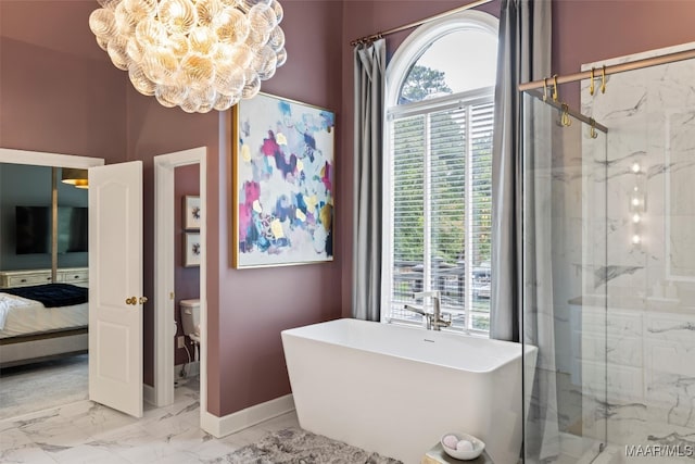 ensuite bathroom with marble finish floor, a notable chandelier, a marble finish shower, a freestanding bath, and ensuite bath