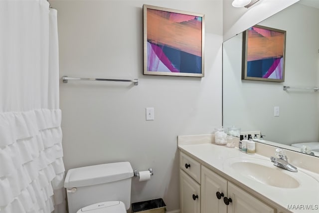 full bathroom featuring toilet and vanity