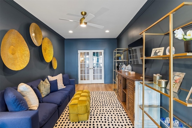 interior space with a ceiling fan, ornamental molding, wood finished floors, french doors, and recessed lighting