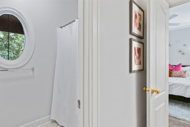 full bathroom featuring baseboards