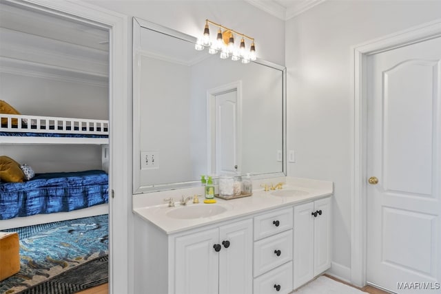 full bathroom featuring ornamental molding, a sink, and double vanity