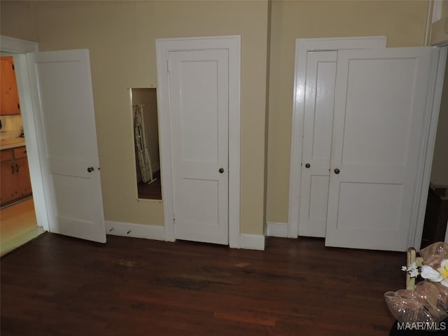 bedroom featuring dark hardwood / wood-style flooring