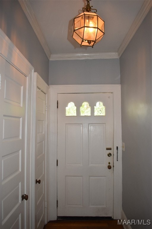 entryway featuring ornamental molding