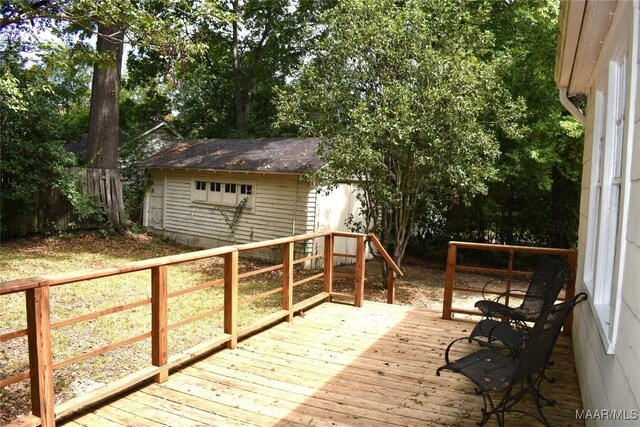 wooden deck featuring a shed