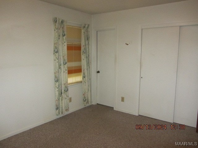 unfurnished bedroom featuring carpet