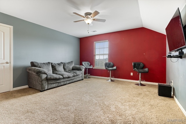 carpeted living room featuring lofted ceiling and ceiling fan