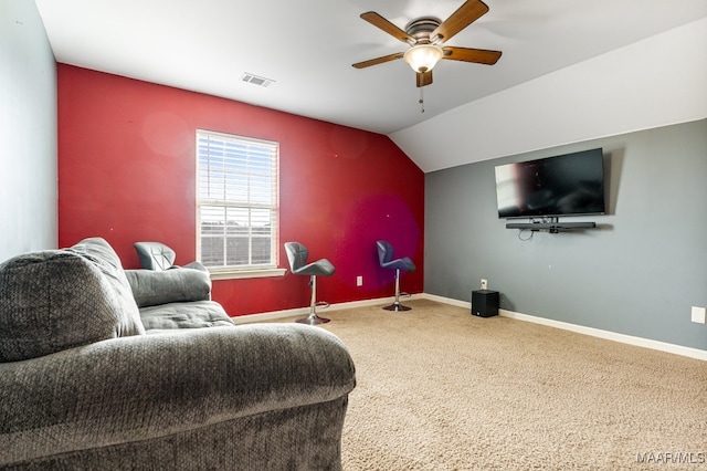 interior space with vaulted ceiling, ceiling fan, and carpet