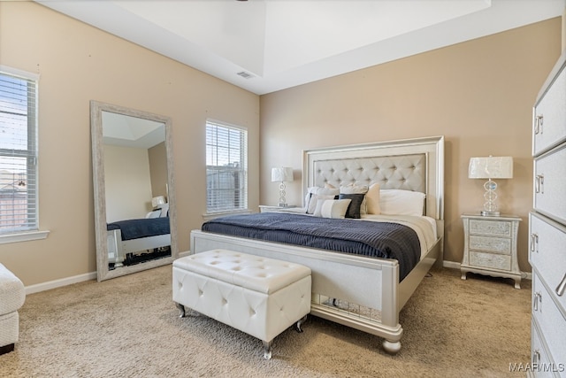 bedroom featuring light carpet