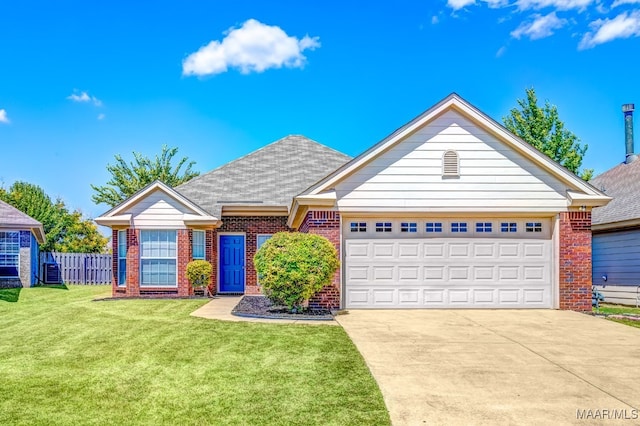 view of front facade featuring a front yard and a garage