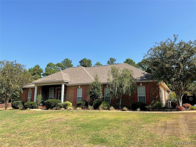 ranch-style home featuring a front yard