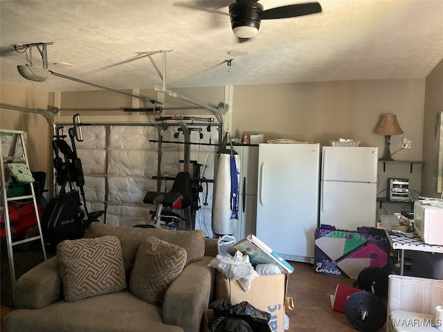 garage featuring ceiling fan and white refrigerator