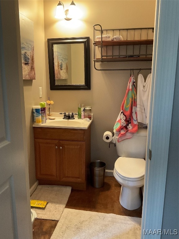 bathroom with vanity and toilet