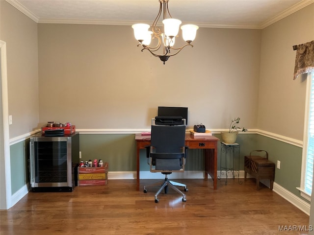 home office with an inviting chandelier, crown molding, and hardwood / wood-style floors