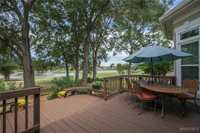 wooden deck with a water view