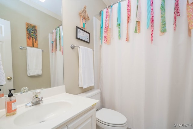 bathroom featuring toilet and vanity