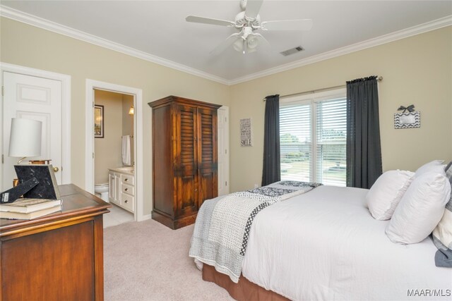 carpeted bedroom with ceiling fan, ornamental molding, and connected bathroom