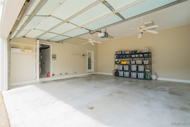 garage featuring a garage door opener and ceiling fan