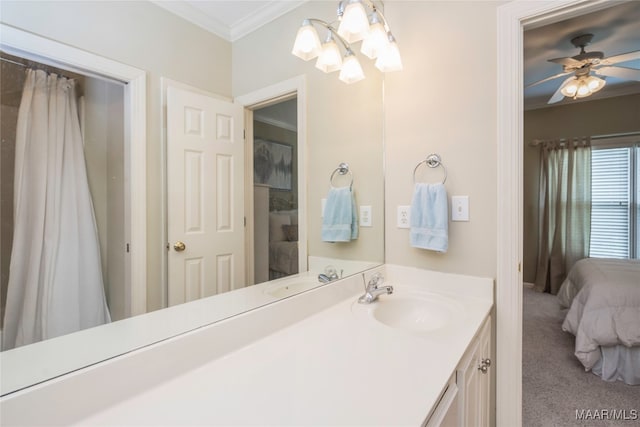 bathroom with vanity, ceiling fan, and ornamental molding