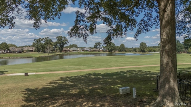 view of home's community featuring a yard and a water view