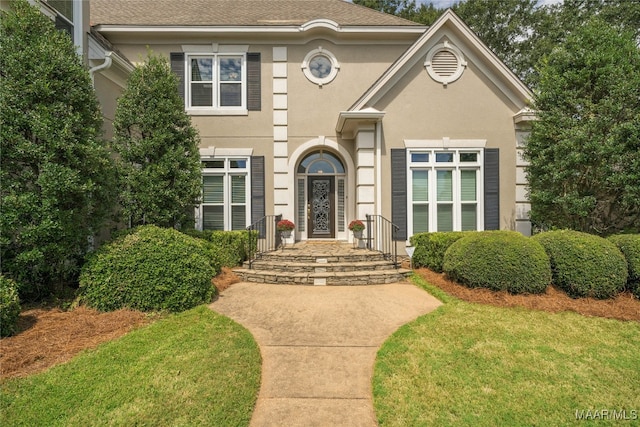 view of front of home with a front yard