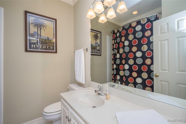 bathroom with crown molding, vanity, toilet, and walk in shower