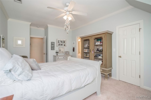 carpeted bedroom featuring ornamental molding and ceiling fan