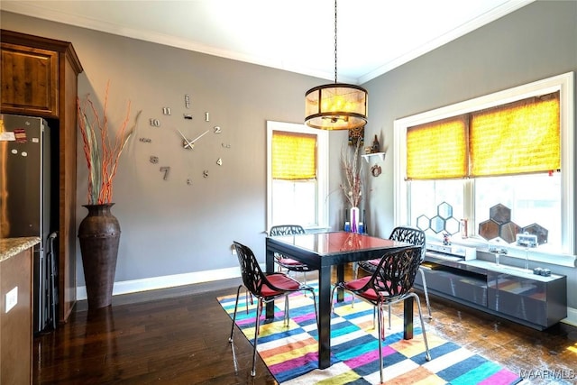 dining space featuring dark hardwood / wood-style flooring and ornamental molding