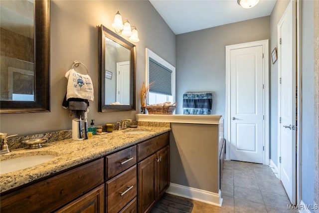 bathroom with tile patterned flooring and vanity