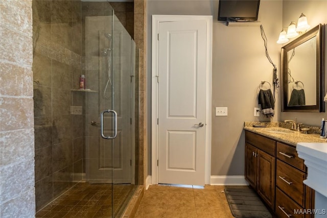 bathroom featuring tile patterned flooring, vanity, and an enclosed shower