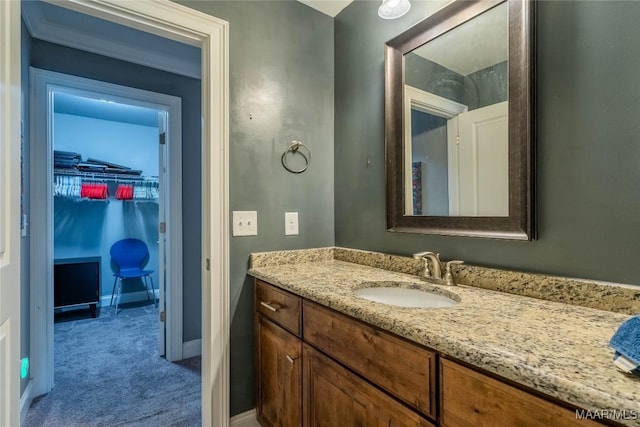 bathroom featuring vanity and crown molding