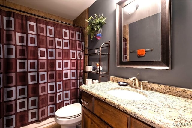 bathroom with a shower with curtain, vanity, and toilet