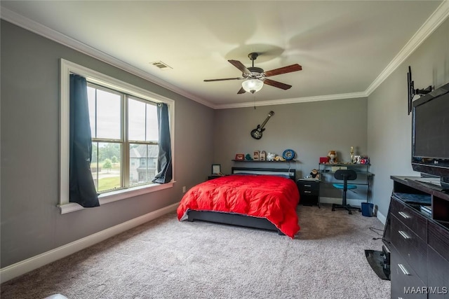 bedroom featuring carpet, ceiling fan, and crown molding