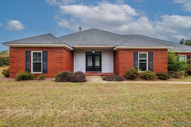 ranch-style home featuring a front yard and french doors