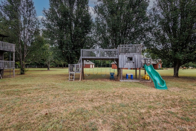 view of jungle gym featuring a lawn