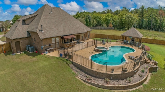 view of pool featuring central air condition unit, a lawn, and a patio area