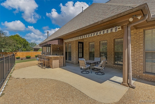 view of patio featuring exterior bar