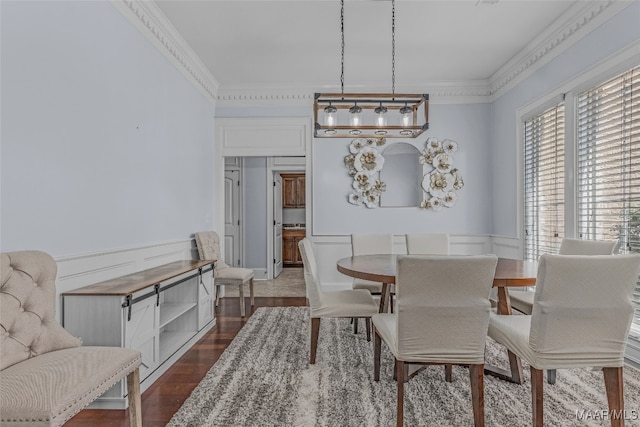 dining area with crown molding and dark wood-type flooring