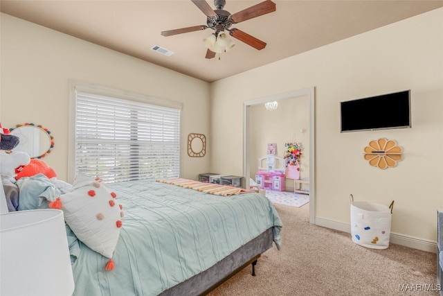 bedroom featuring light carpet and ceiling fan