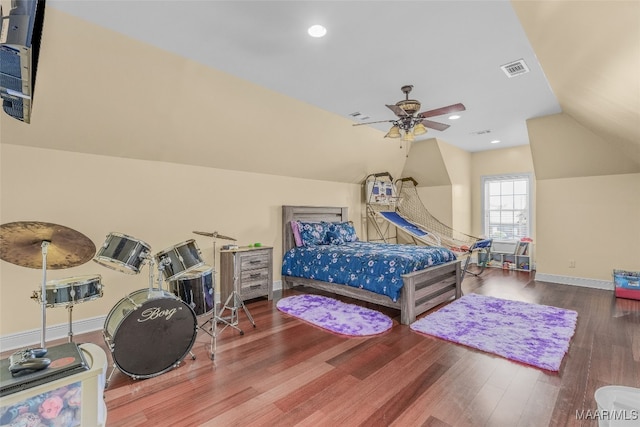 bedroom featuring ceiling fan, hardwood / wood-style flooring, and vaulted ceiling